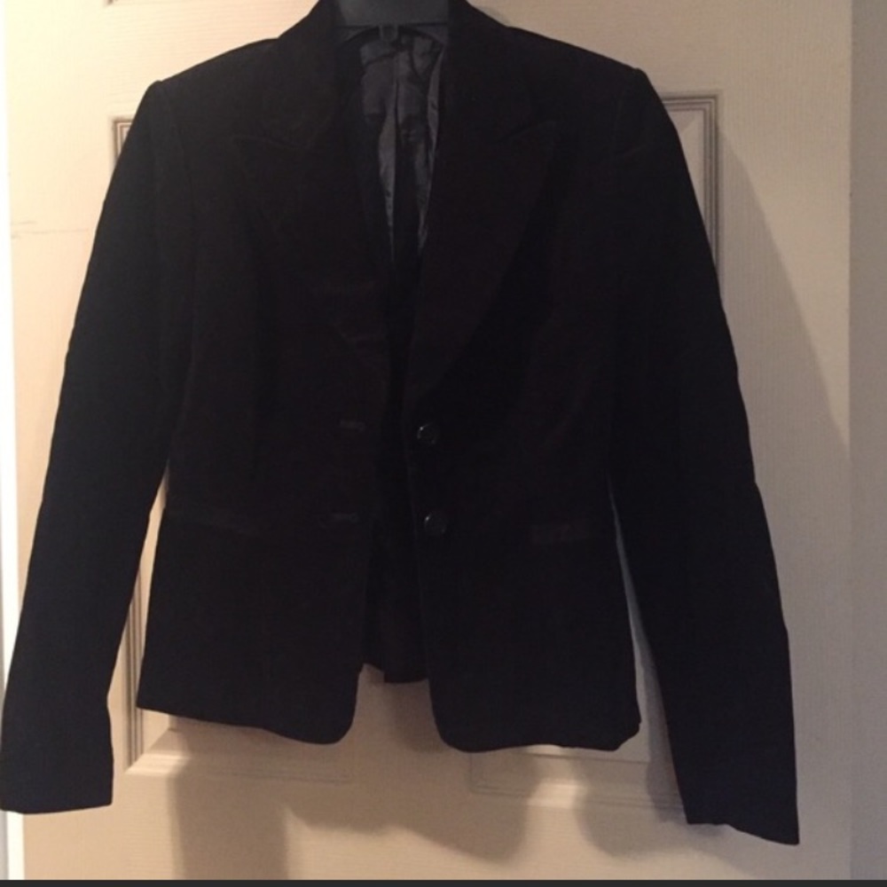 Fitted cord jacket with bow in back